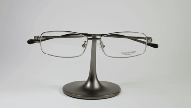 a pair of eyeglasses on a stand with a sparkling clean lens create in horizontal format do not write text on image
