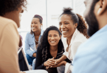 diverse people connecting and smiling during a deep conversation at a social gathering horizontal format no text