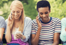diverse group of friends enjoying mobile conversation horizontal format