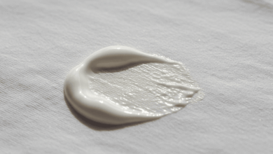 close-up of a stubborn sunscreen stain on a white t-shirt create in horizontal format do not write text on image