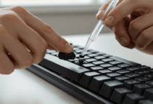 a person carefully removing keyboard keys for a deep clean create in horizontal format do not write text on image