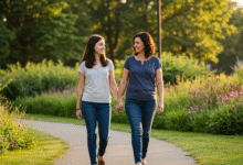 a mother and daughter walking hand in hand in a peaceful park showing mutual support and understanding