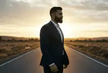 a man standing confidently at a crossroads representing new beginnings after a difficult period